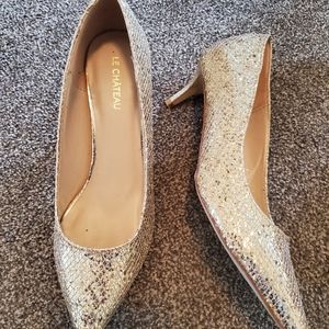 Gold high heeled shoes